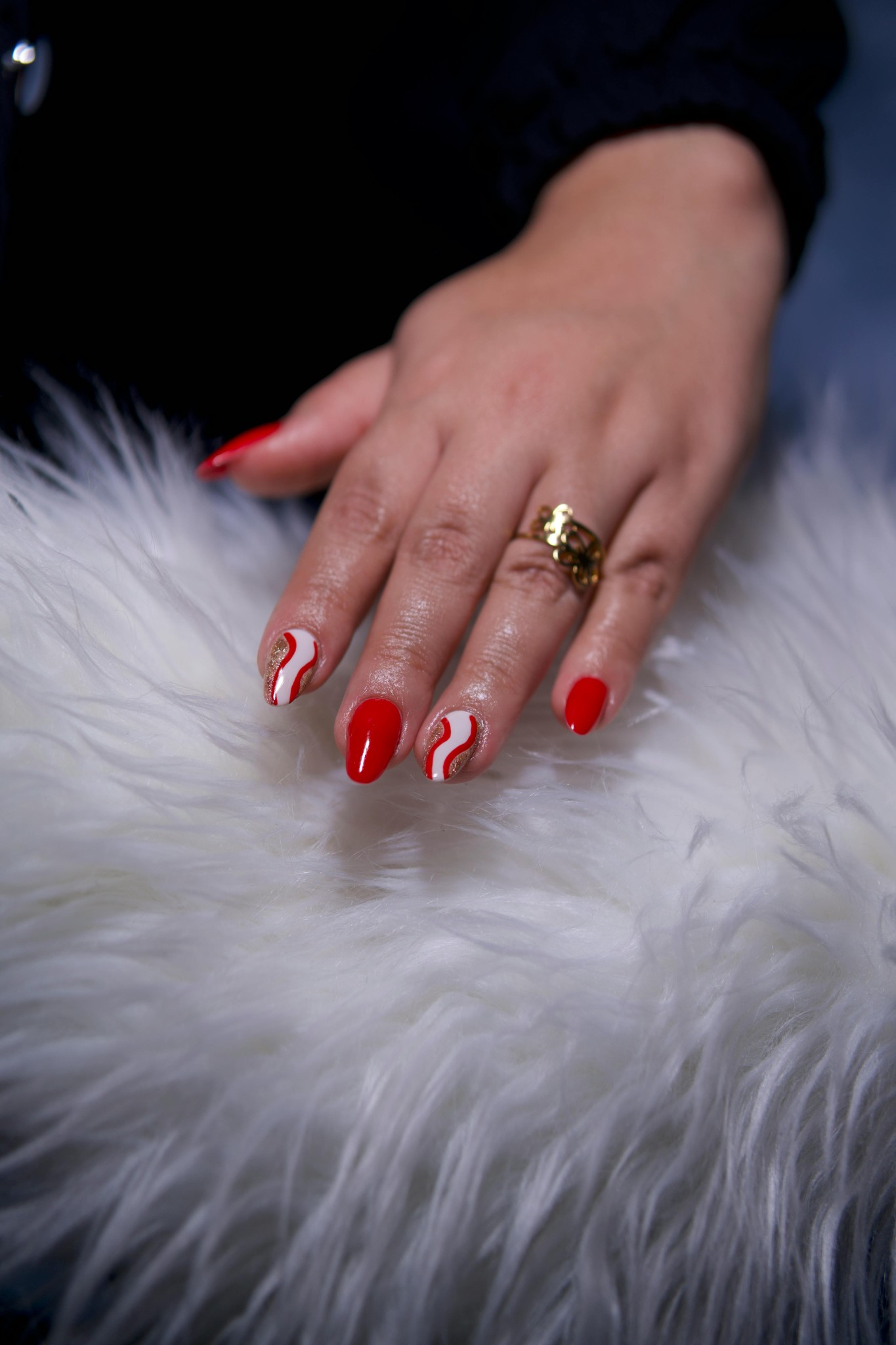 Red swirl nail art on fur
